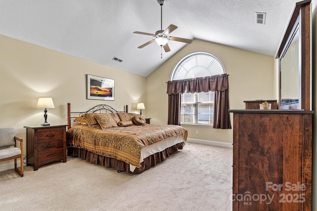 bedroom featuring lofted ceiling, light colored carpet, visible vents, and baseboards