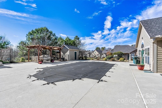 community pool with a patio area, a residential view, fence, and a pergola