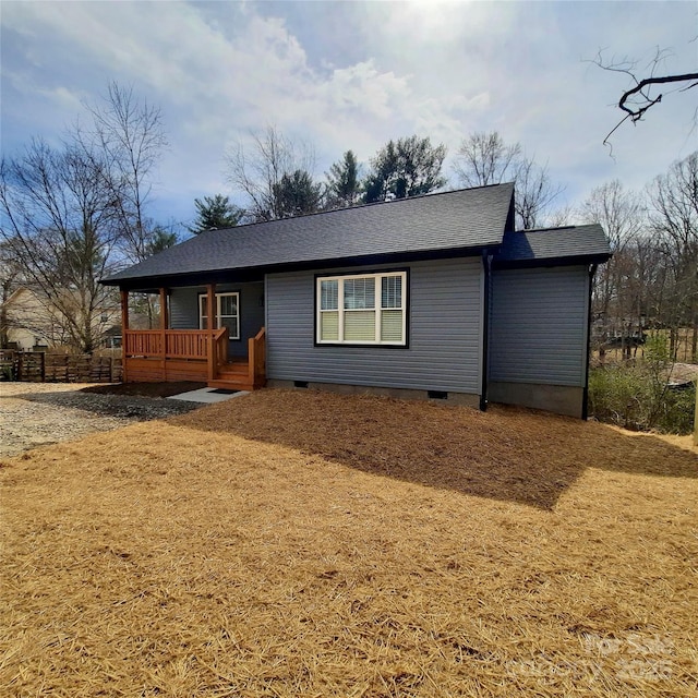 ranch-style house with a shingled roof and crawl space