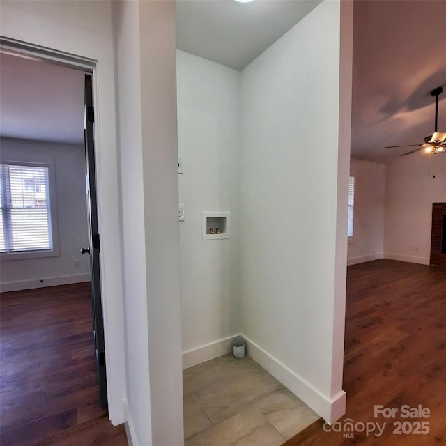 clothes washing area with hookup for a washing machine, a fireplace, baseboards, and ceiling fan