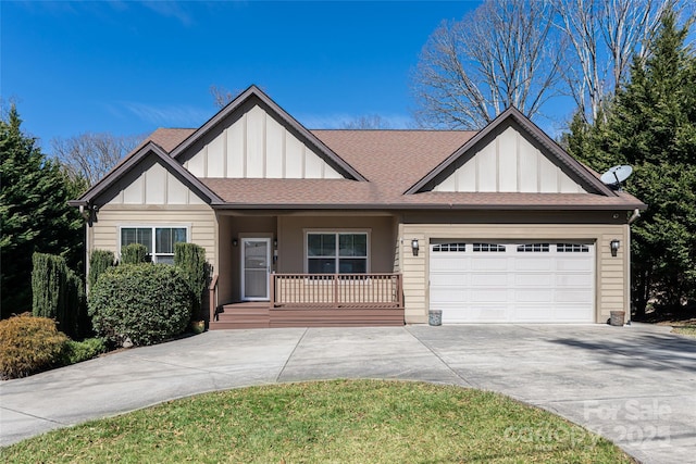 view of front of home featuring board and batten siding, concrete driveway, a porch, and a garage