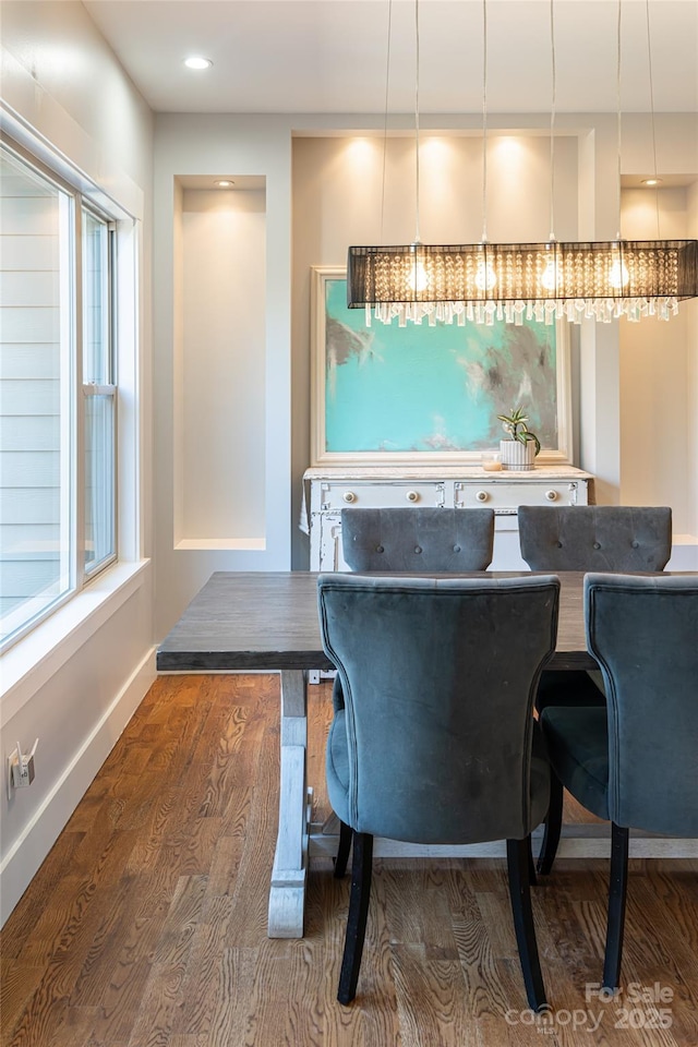 bar featuring baseboards and wood finished floors