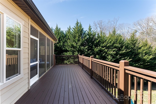 wooden terrace featuring a sunroom