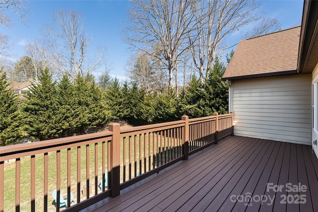 deck featuring a lawn