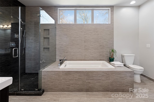 bathroom with toilet, tile patterned flooring, a shower stall, and a bath