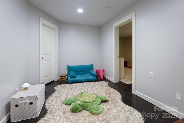 interior space featuring baseboards, dark wood-type flooring, and recessed lighting