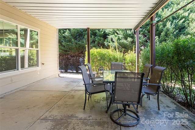 view of patio featuring outdoor dining area