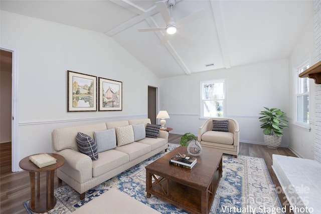 living room featuring visible vents, vaulted ceiling with beams, baseboards, wood finished floors, and a ceiling fan