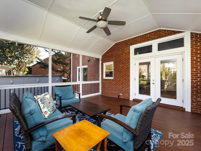 wooden terrace featuring french doors, outdoor lounge area, and a ceiling fan