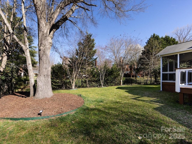 view of yard with a sunroom