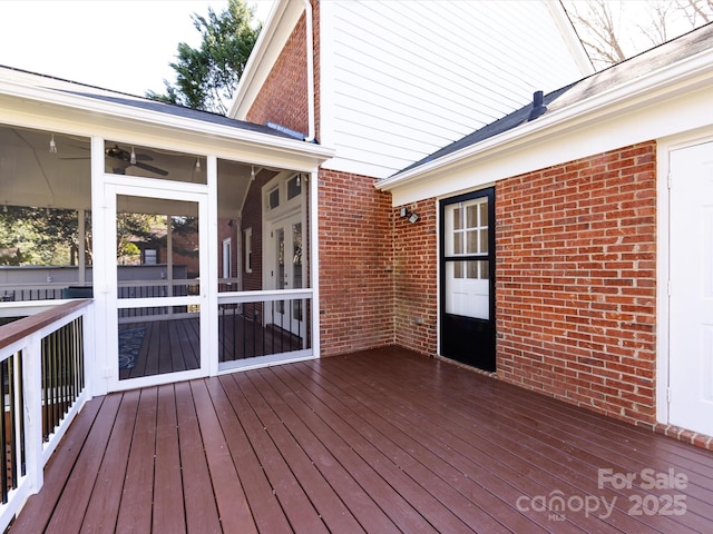 wooden terrace featuring a sunroom