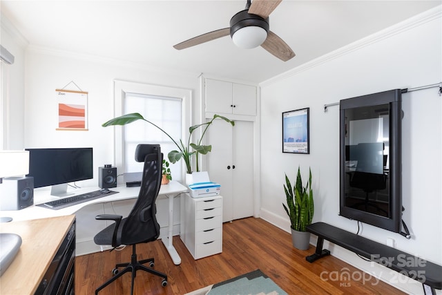 office space featuring ornamental molding, wood finished floors, and a ceiling fan