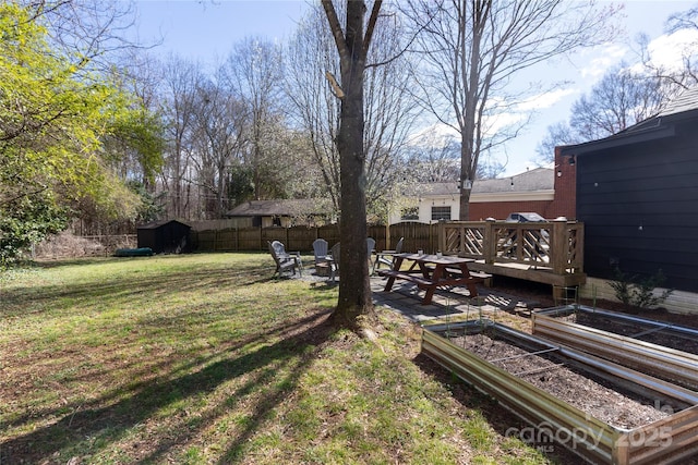 view of yard featuring a garden and fence