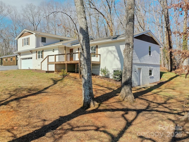 exterior space featuring brick siding, a lawn, and an attached garage