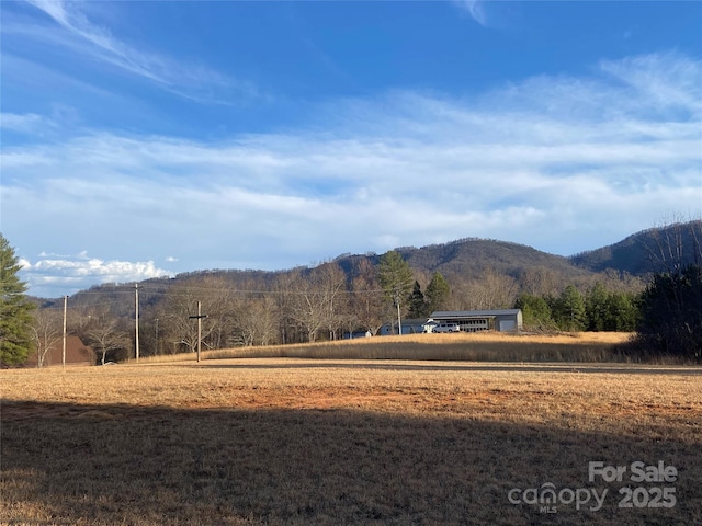 property view of mountains featuring a rural view