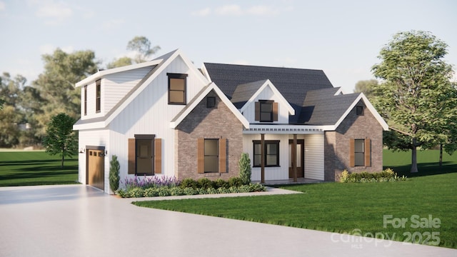 modern inspired farmhouse featuring concrete driveway, brick siding, a front lawn, and an attached garage