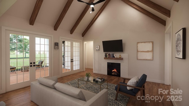 living area featuring high vaulted ceiling, french doors, a lit fireplace, and wood finished floors