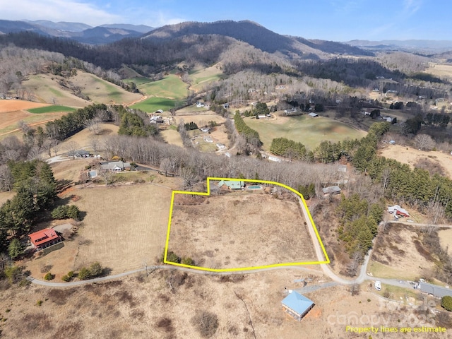 bird's eye view with a rural view and a mountain view