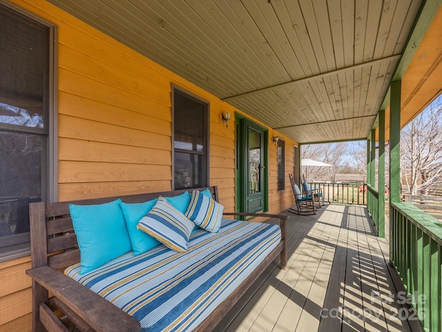 wooden terrace with covered porch