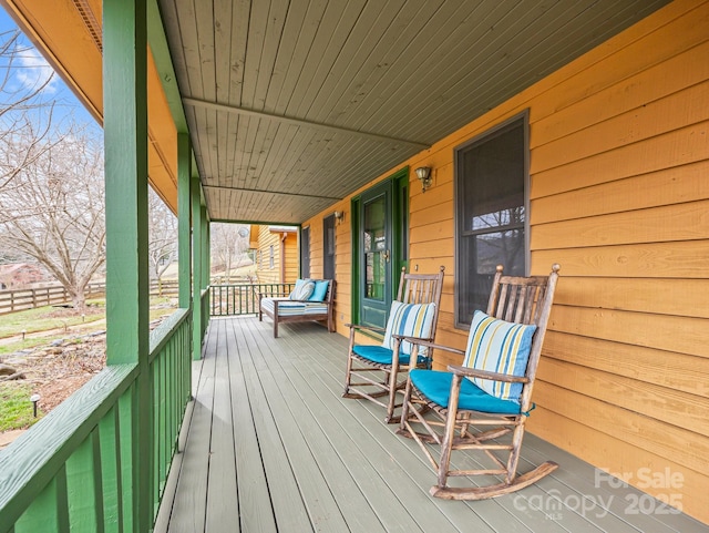 wooden terrace featuring a porch