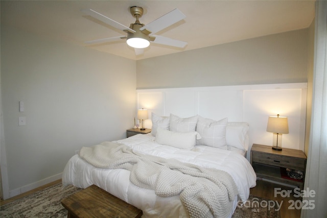 bedroom featuring wood finished floors and a ceiling fan