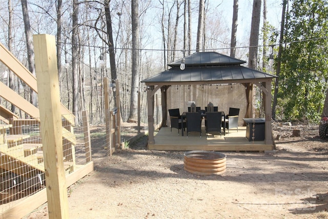 exterior space with a deck and a gazebo