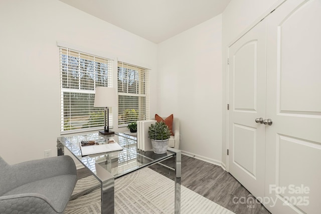 office space featuring baseboards and wood finished floors