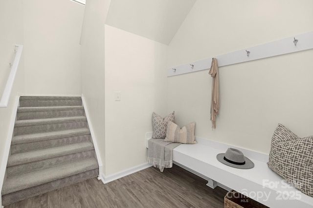 mudroom featuring vaulted ceiling, wood finished floors, and baseboards