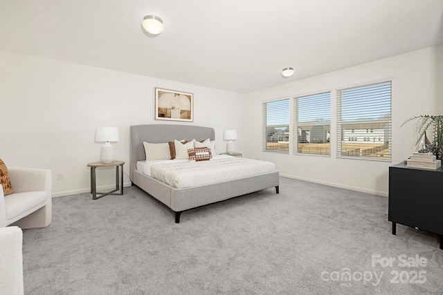 carpeted bedroom with baseboards