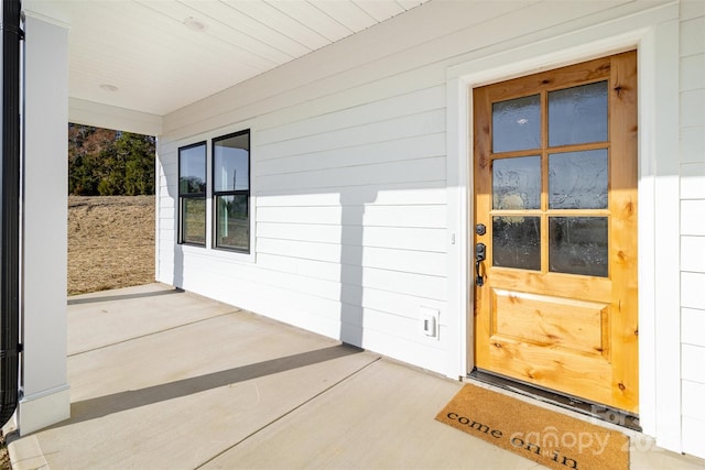 entrance to property with covered porch