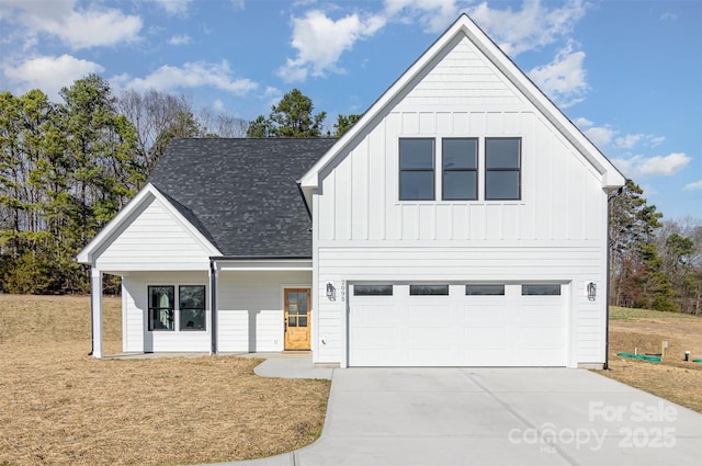 modern farmhouse style home featuring roof with shingles, an attached garage, board and batten siding, driveway, and a front lawn