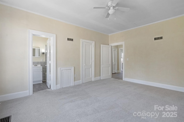 unfurnished bedroom featuring carpet flooring and visible vents