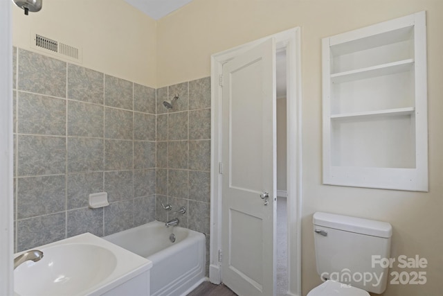 full bath with shower / bath combination, visible vents, and toilet