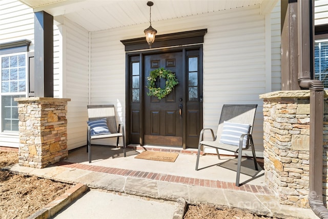 property entrance featuring covered porch