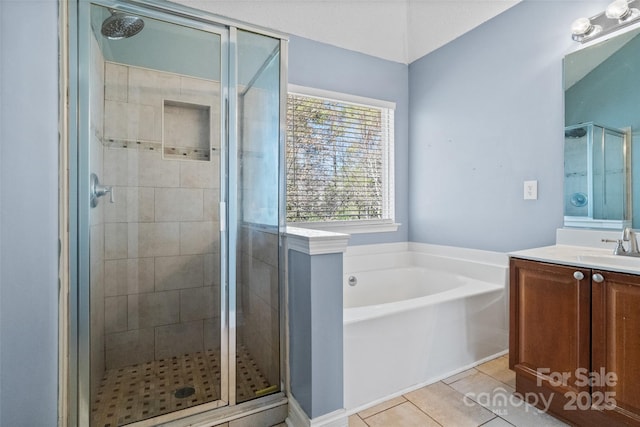 full bathroom with vanity, tile patterned flooring, a bath, and a shower stall