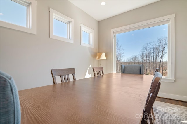 dining space featuring baseboards