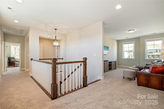 corridor featuring attic access, visible vents, carpet, an upstairs landing, and recessed lighting