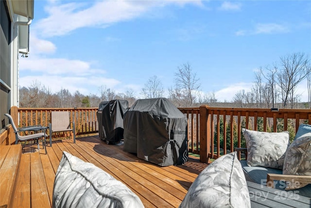 wooden terrace featuring grilling area