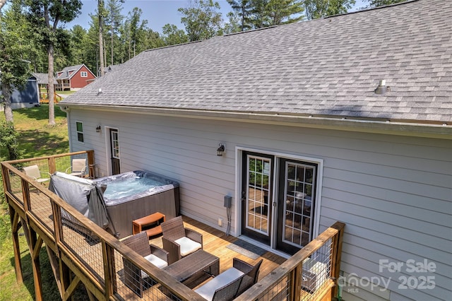 deck with a hot tub