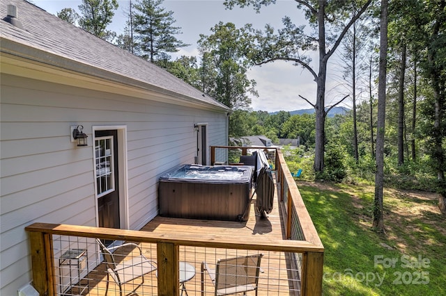 deck with a hot tub