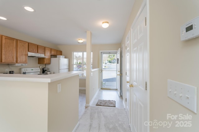 kitchen with recessed lighting, freestanding refrigerator, light carpet, range with electric cooktop, and under cabinet range hood