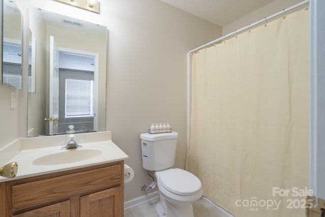 full bathroom featuring toilet, visible vents, a textured ceiling, and vanity