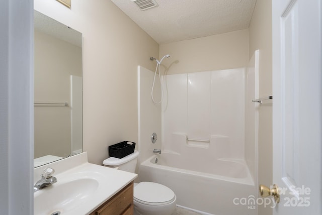 bathroom featuring visible vents, toilet, tub / shower combination, a textured ceiling, and vanity