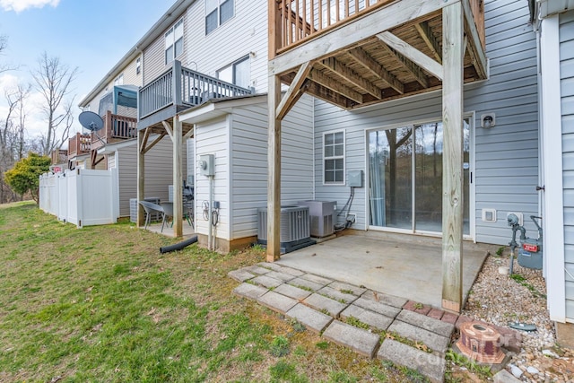 view of patio with fence, a deck, and cooling unit