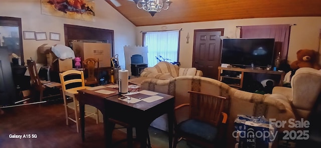 living area with a chandelier and lofted ceiling