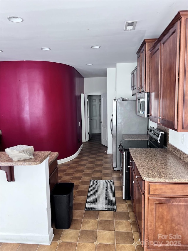 kitchen featuring stainless steel appliances, recessed lighting, visible vents, tile patterned flooring, and baseboards