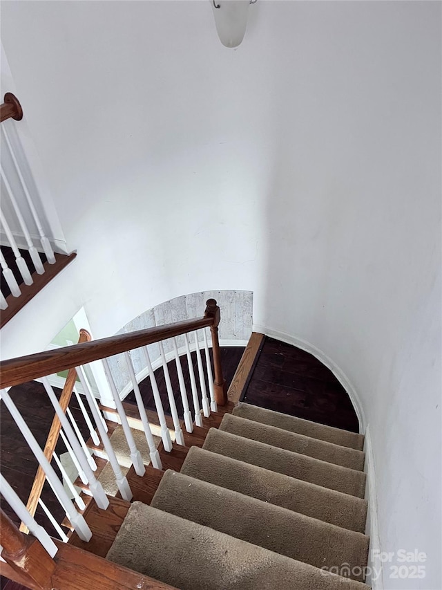 stairs with wood finished floors