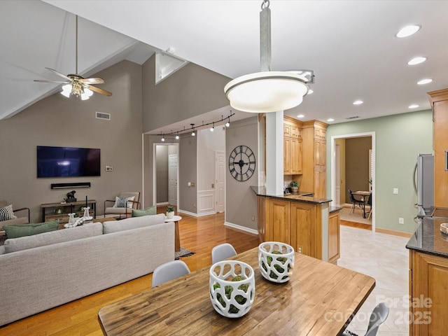 dining space featuring visible vents, high vaulted ceiling, recessed lighting, baseboards, and ceiling fan