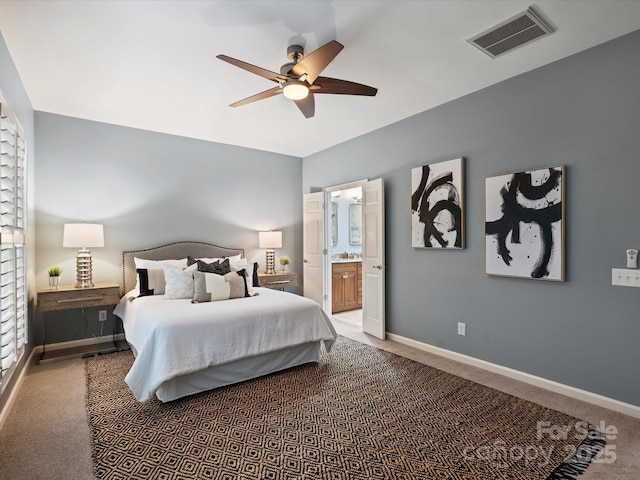 bedroom with visible vents, baseboards, carpet, and connected bathroom