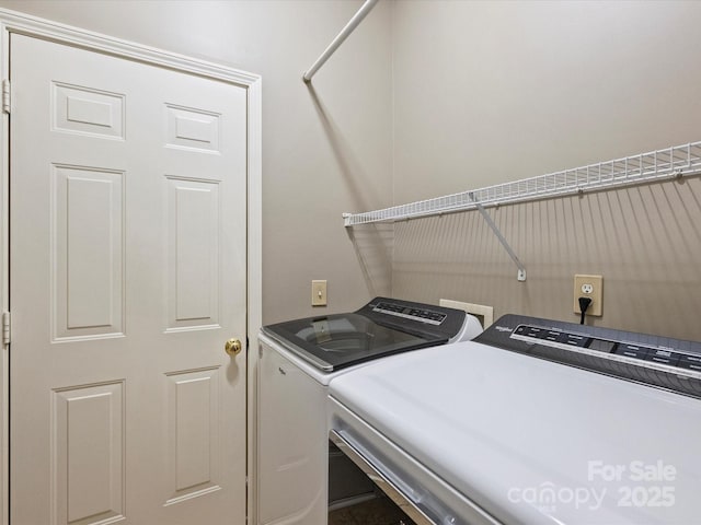 laundry area with washer and dryer and laundry area